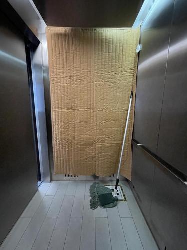 inside elevator with mop