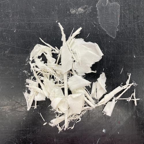 ripped paper black table