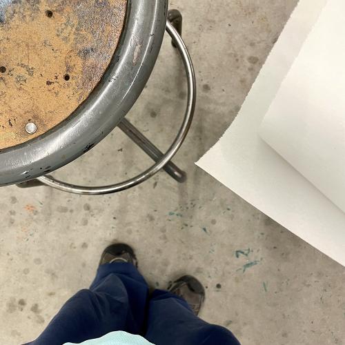 stool newsprint and shoes