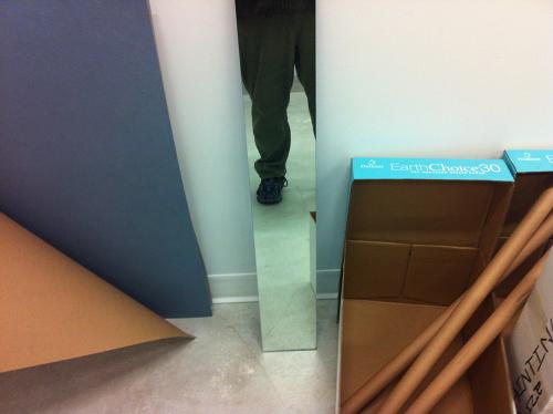 miscellaneous cardboard and leg reflection