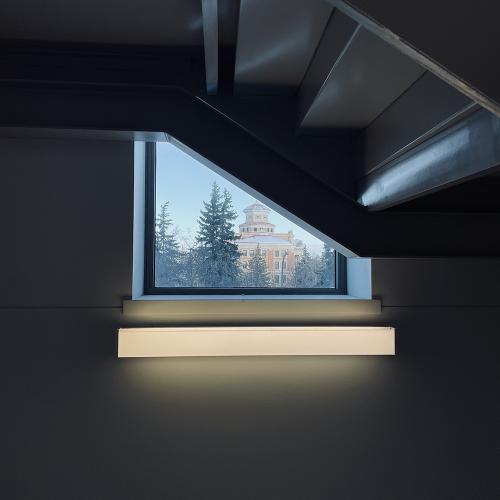 distant building framed by window in a stairwell