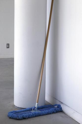 white room, blue mop