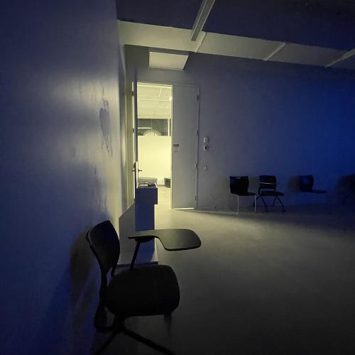 blue lit white classroom