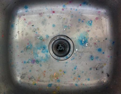 sink splattered with coloured inks