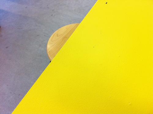 yellow table and wooden topped stool